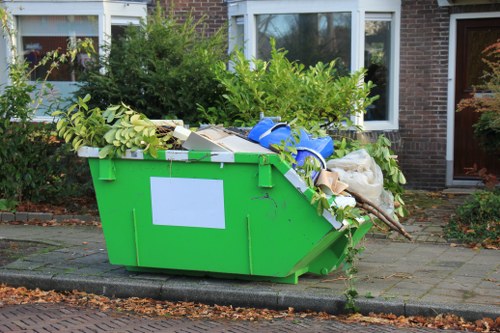 Workers managing construction debris in Bow