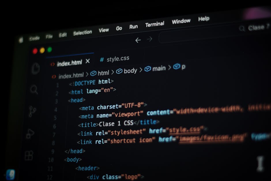 Close-up view of a computer screen displaying lines of HTML code in a text editor. The code includes tags such as <html>, <head>, <title>, and <meta>, with syntax highlighting 